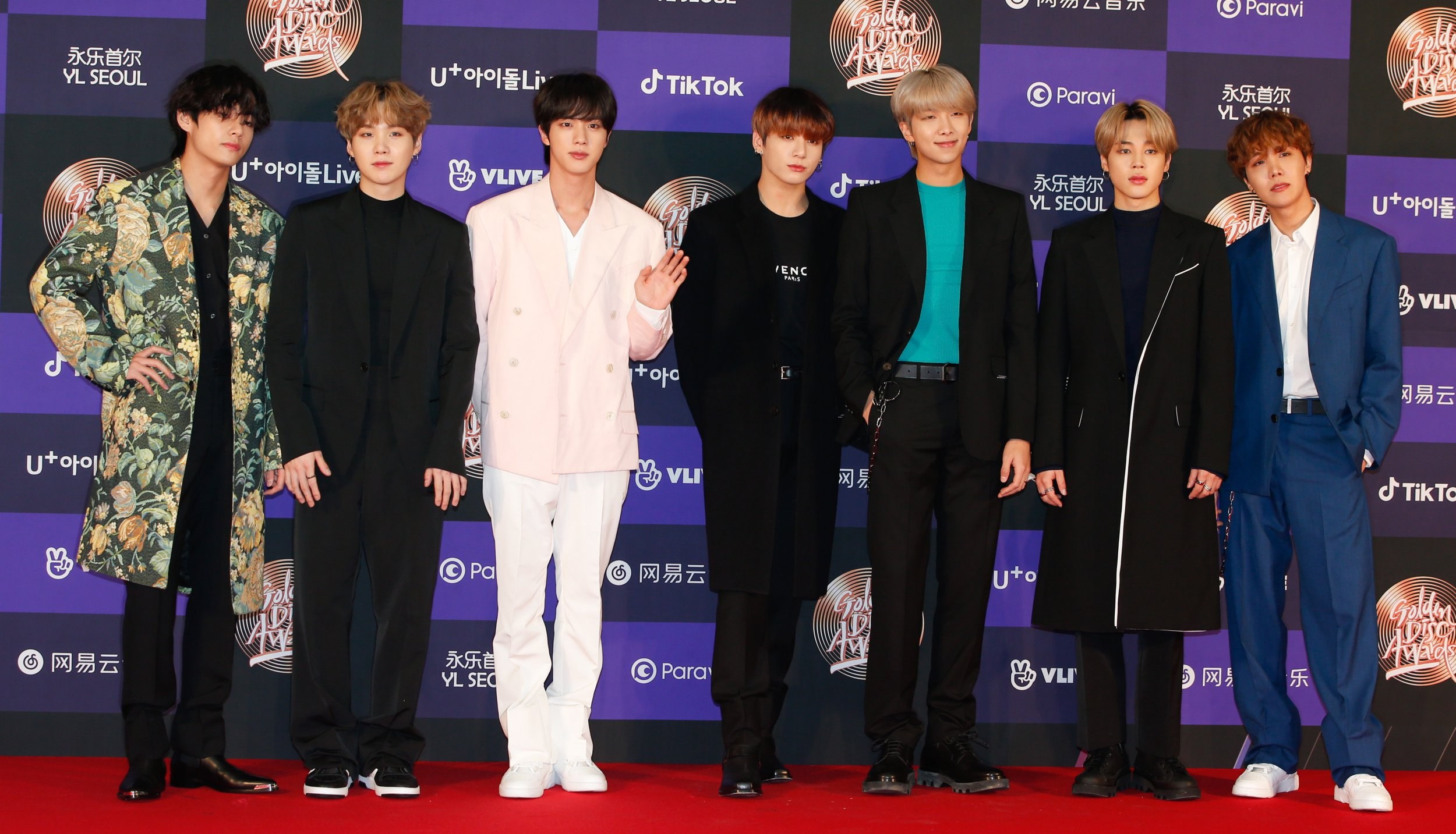 epa08103915 Members of South Korean boy band 'Bangtan Boys, BTS' pose as they arrive for the 34st annual Golden Disk Awards ceremony at the Gocheok Sky Dome in Seoul, South Korea, 05 January 2020. The Golden Disc Awards is recognized as the most traditional music awards ceremony in South Korea, with an award ceremony to select the best albums, singers and producers in the Korean pop scene. EPA/KIM HEE-CHUL