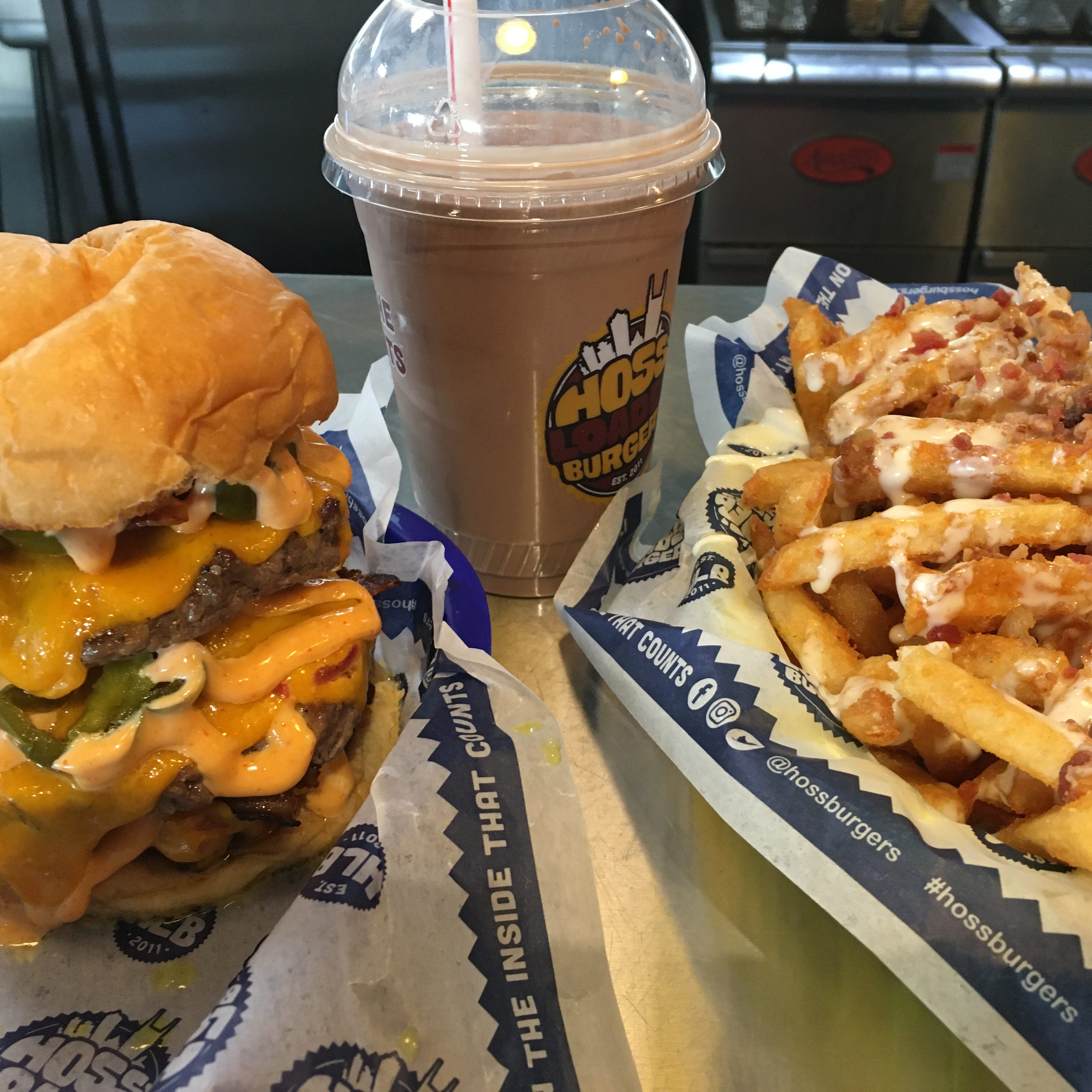 A one-pound cheeseburger, milkshake and loaded queso fries make up the Jaw Dropper Challenge meal offered by Hoss' Loaded Burgers in Nolensville, Tenn.