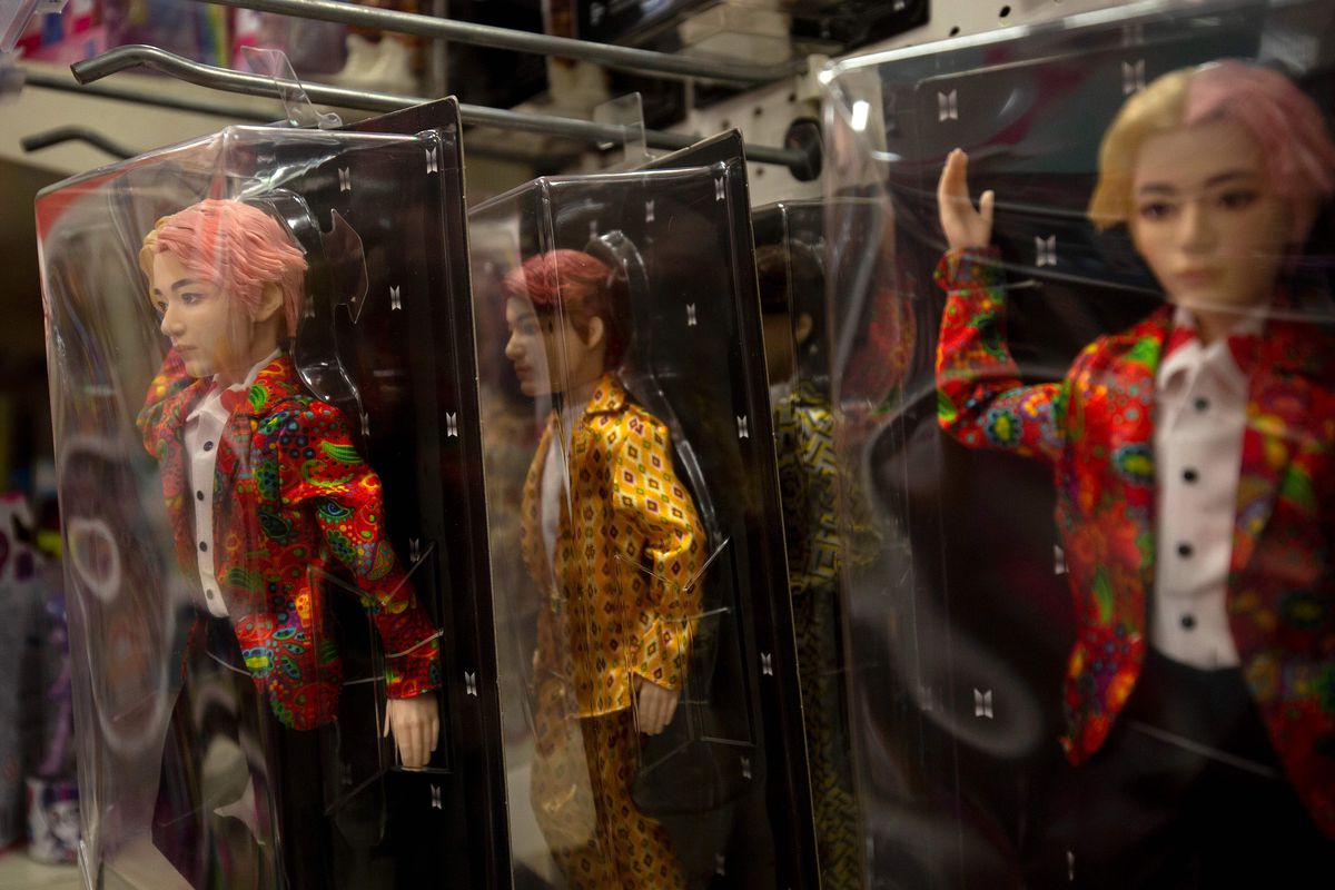 South Korean boy band BTS toy dolls are seen at a store in Washington, DC.
