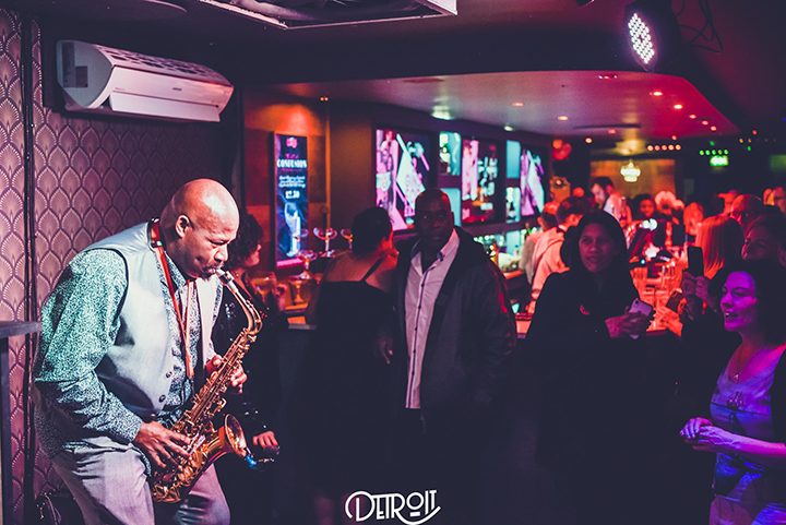 A saxophonist performing at Detroit