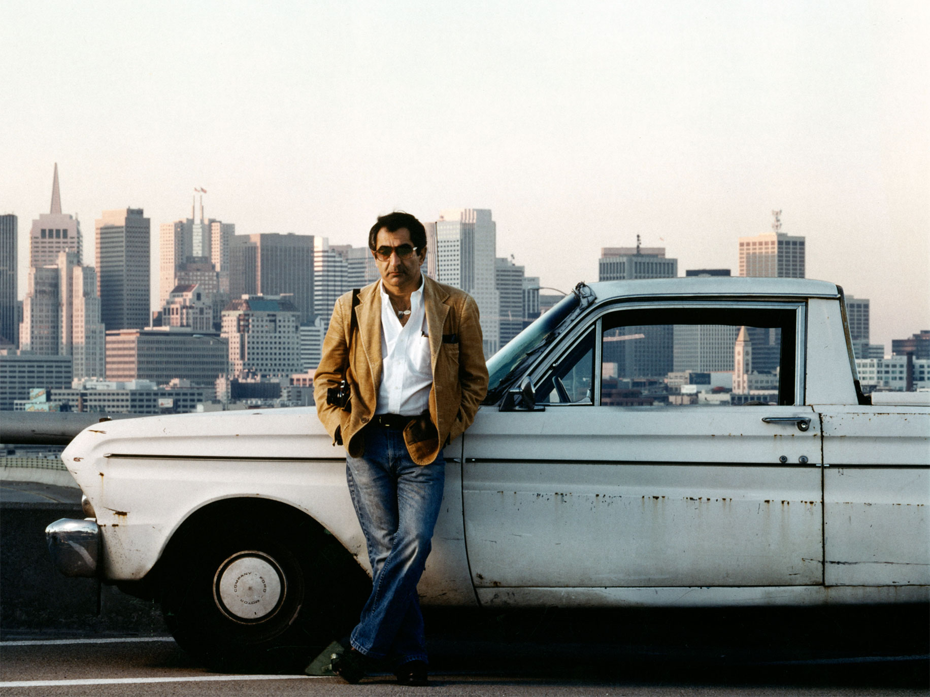 Jim Marshall with his truck on a Highway 101 off-ramp, San Francisco, circa 1985.