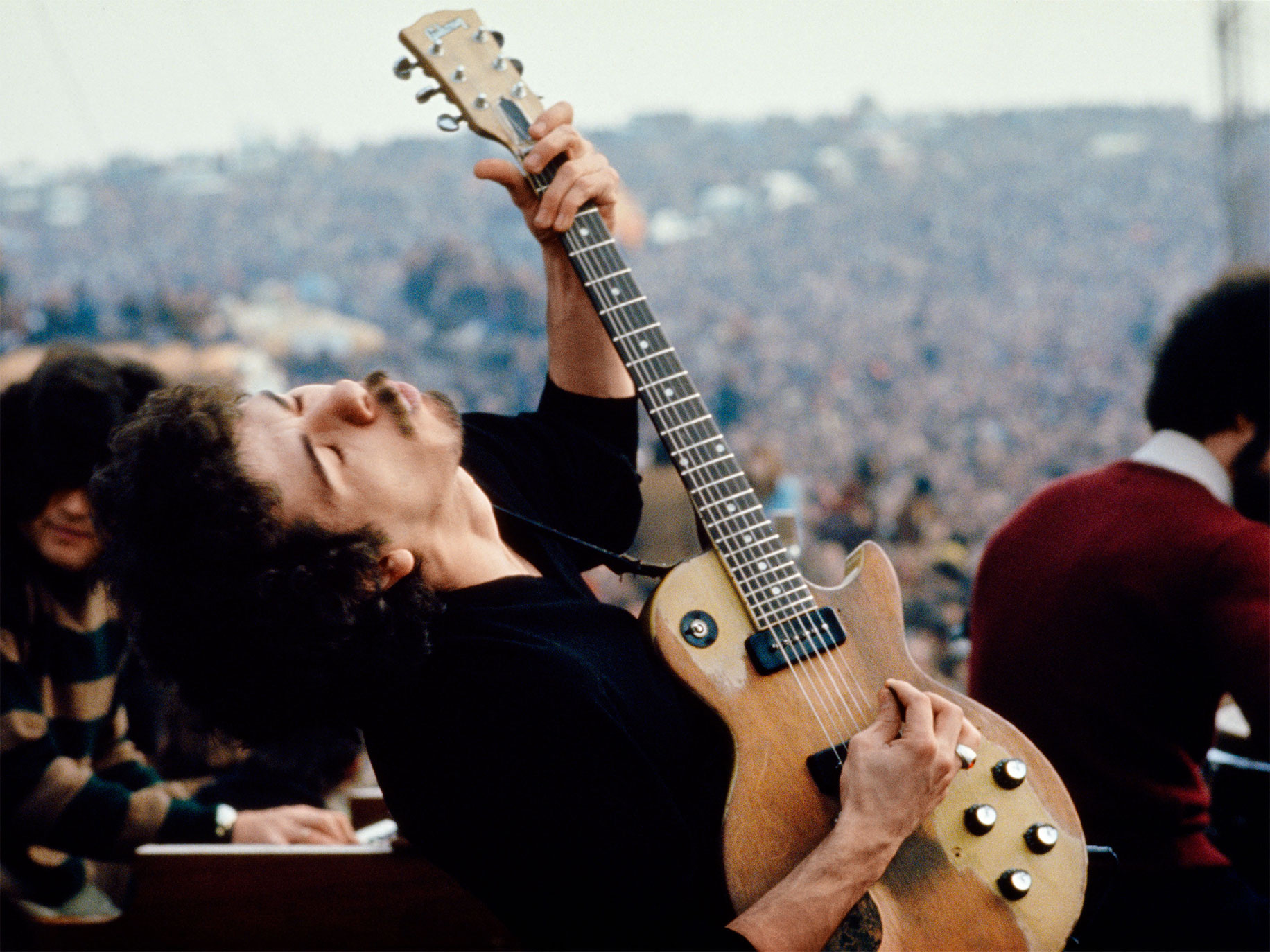 Carlos Santana performing at the Altamont Free Festival, Altamont Speedway, California, 1969.