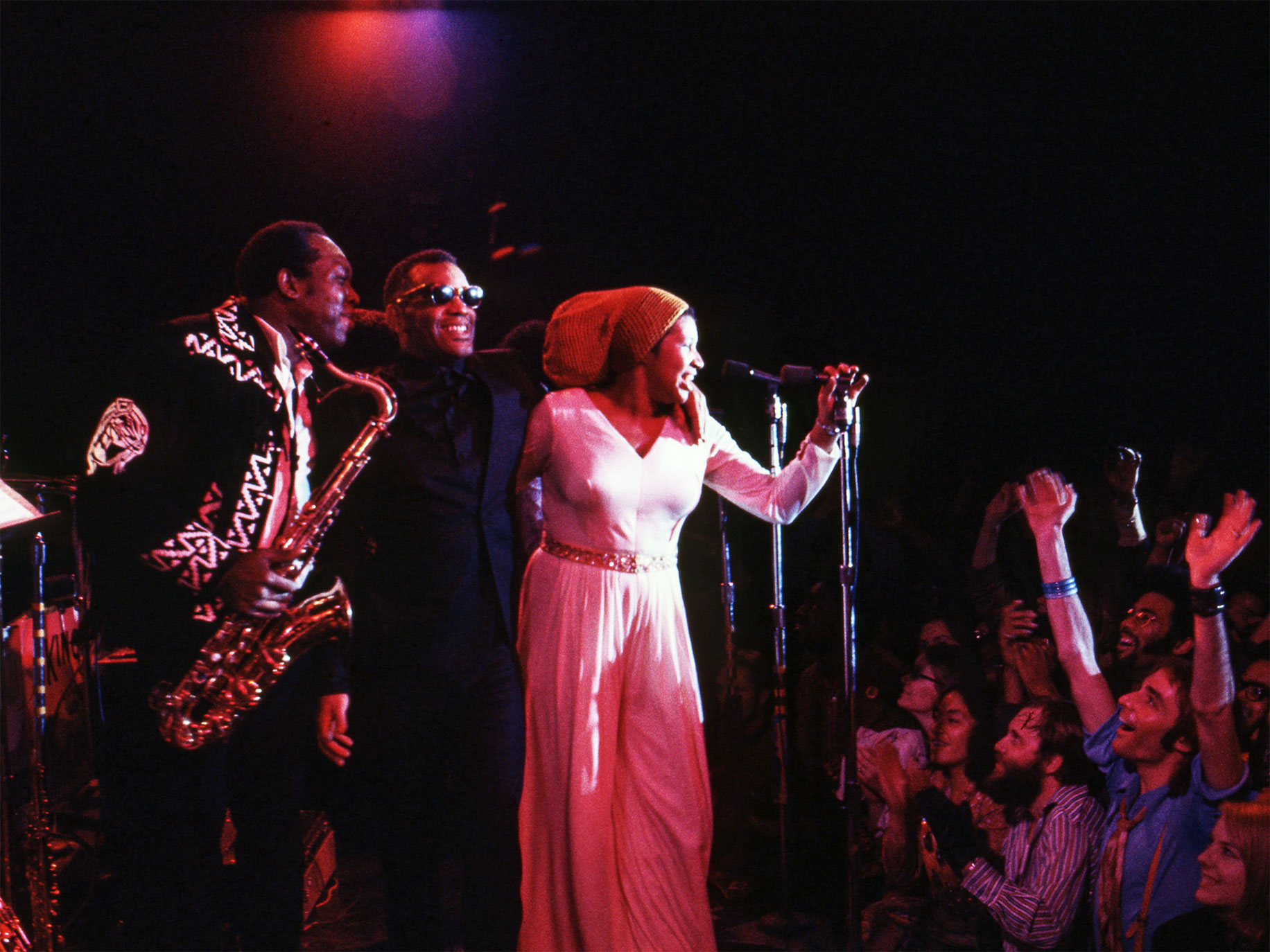 King Curtis, Ray Charles (center), and Aretha Franklin at the Fillmore West, San Francisco, 1971.