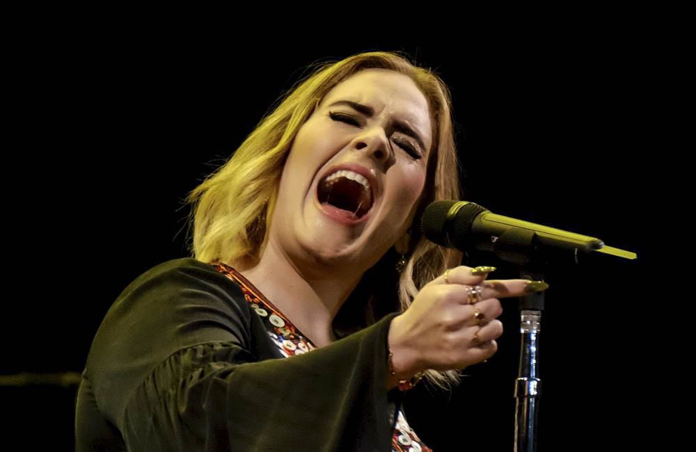Adele is 'pouring her heart and soul' into her new record
