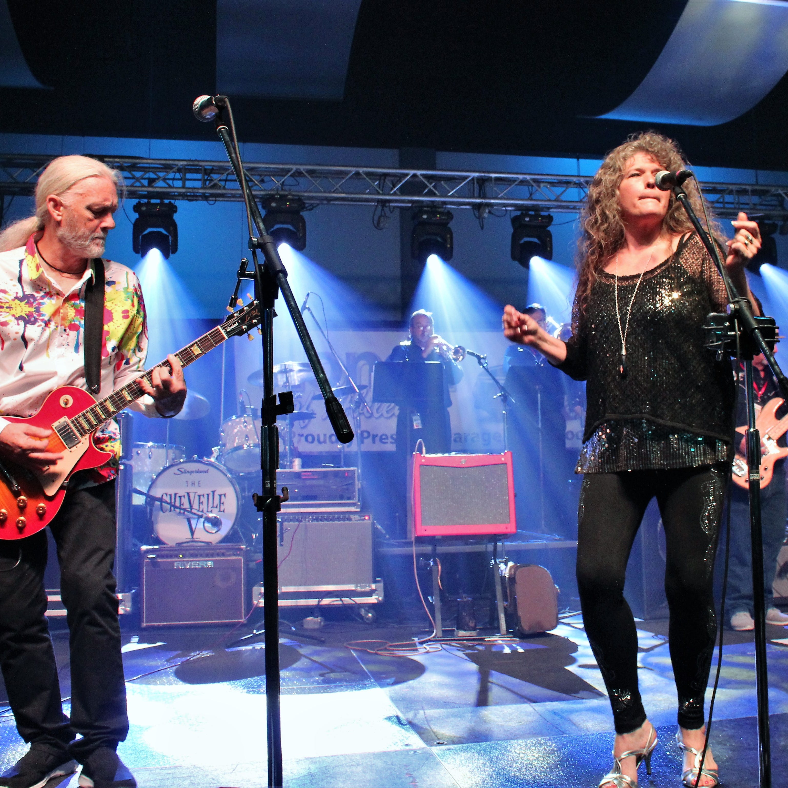 Husband and wife Doug and Shannon Roysden, left, joined several bands on stage before Doug's band, DRB, had a late-night reunion at Garageband Woodstock on Saturday evening at the Abilene Convention Center. July 27 2019