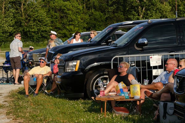 Fans at a drive-in Yacht Rock Revue concert enjoyed the show from a distance.